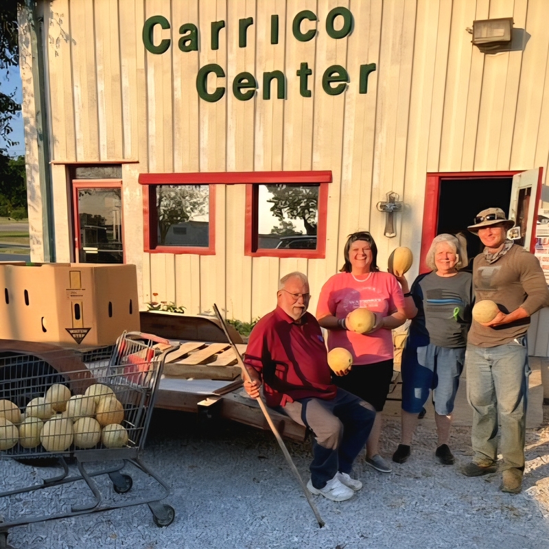 Dickie Carter (in red) delivering Cantaloupes to the Carrico Center.