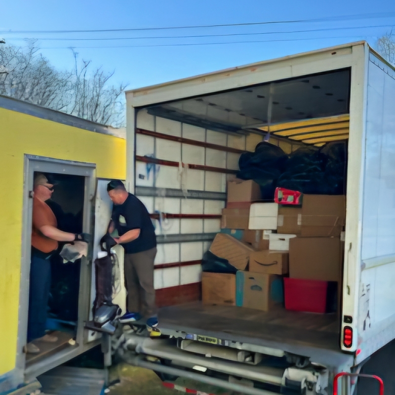 Mountain Missions loading items into their truck