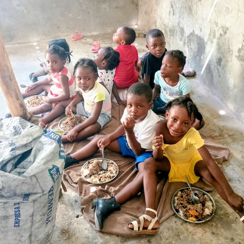 House of Love children eating a meal